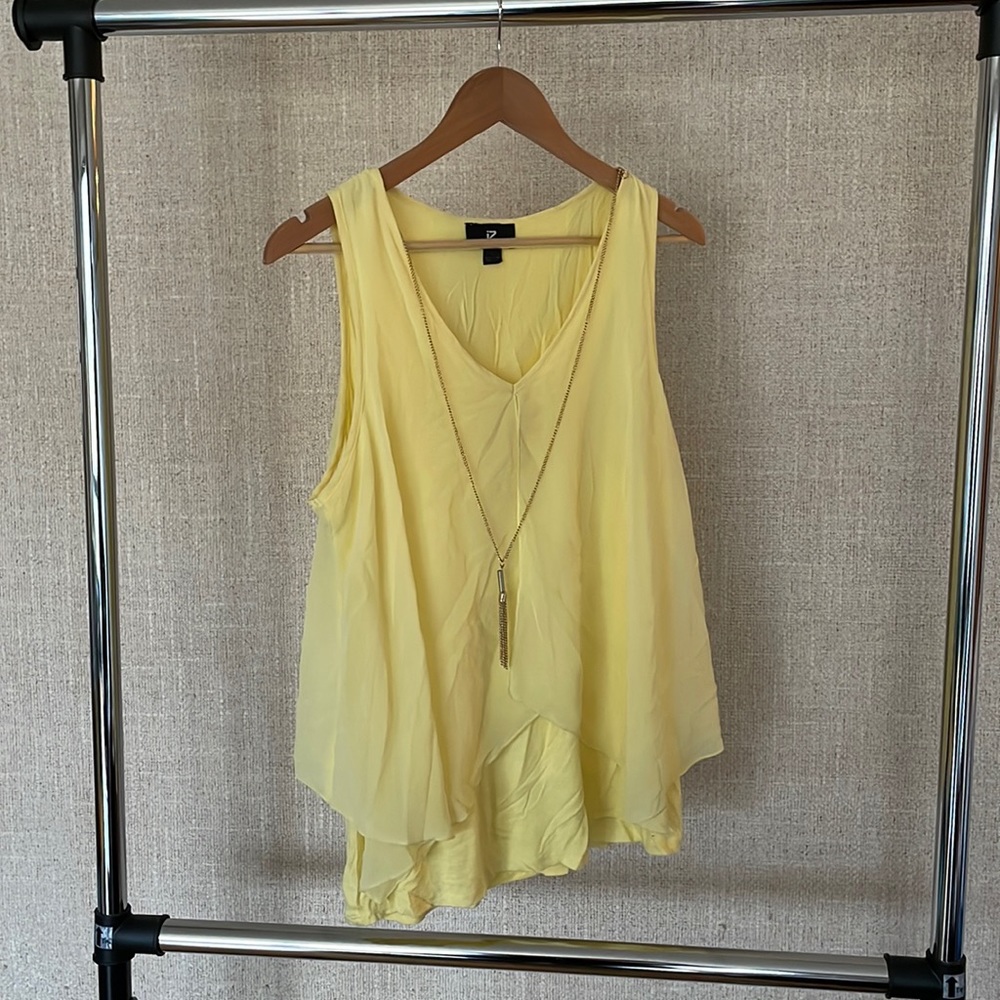 Yellow no sleeve blouse